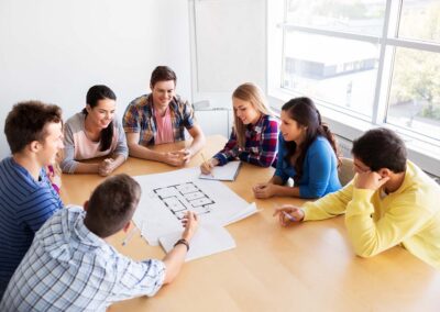Group studying architectural blueprint plans