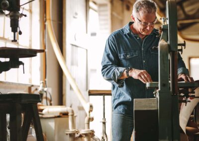 Carpenter working on band saw